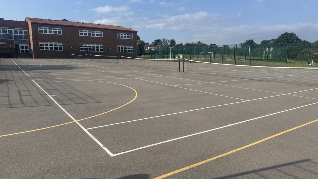 Netball & Tennis Courts (MUGA) at Esher Church Of England High School in Surrey